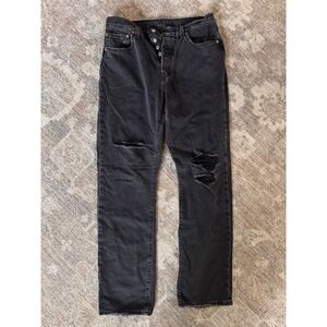 classic Levi's 501 black distressed finish. button fly and  five-pocket styling.